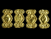 A GROUP OF FOUR GREEK GOLD ORNAMENTS
Circa 5th-4th century BC.
Dress ornaments made of thin gold sheet and decorated with a dotted spiral design worke...
