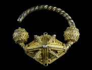 A HIGHLY ELABORATE SILVER GILT BYZANTINE/SLAVIC TEMPLE RING
Circa 10th-12th century AD.
Hollow formed earring with twisted hook. The body decorated wi...