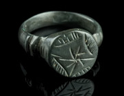 A LATE MEDIEVAL/EARLY MODERN BRONZE RING
Circa 15th-16th century AD.
With a raised round bezel decorated with an ornamental design.
Ring size 61 (EU) ...