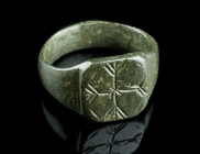 AN EARLY MODERN BRONZE RING
Circa 16th-17th century AD.
With an oval bezel decorated with an ornamental cross.
Ring size 57 (EU) Ex European private c...