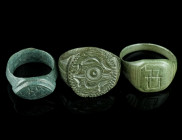 THREE MEDIEVAL/EARLY MODERN BRONZE RINGS
Circa 14th-17th century AD.
Three rings of different shape and design with incised and/or punched decoration....