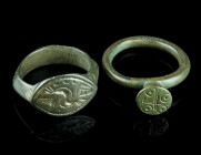 A BYZANTINE AND A MEDIEVAL/EARLY MODERN BRONZE RING
Circa 6th-9th century, and 15th-17th century AD.
A Byzantine ring with projecting bezel with an or...