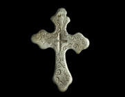 A DECORATED BYZANTINE SILVER CROSS
Circa 9th-12th century AD.
Silver cross with incised and punched decoration, an incised cross in the centre. Two lo...