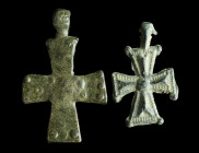 TWO INSCRIBED BYZANTINE LEAD CROSS PENDANTS
Circa 9th-12th century AD.
The smaller cross with relief decoration on the obverse, the reverse features t...