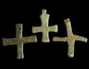 THREE BYZANTINE LEAD CROSS PENDANTS
Circa 5th-7th century AD.
Two plain cross pendants and one with incised decoration. All with a loop or hole for su...