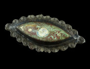 A ROMAN ENAMELLED BRONZE POINTED OVAL BROOCH
Circa 2nd century AD.
With a raised centre decorated with coloured enamel and a scalloped border with a p...