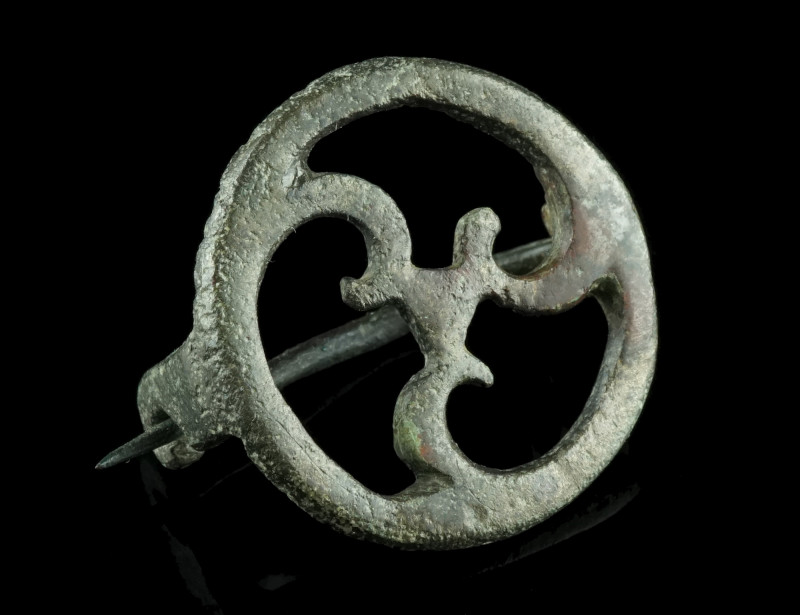 A ROMAN BRONZE OPENWORK DISK BROOCH
Circa 2nd-3rd century AD.
With an openwork t...