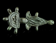 AN OSTROGOTHIC BRONZE BROOCH
Circa 5th-6th century AD.
Brooch with semicircular head plate with five knobs and lozenge-shaped foot with four periphera...