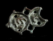 A BYZANTINE BRONZE BREAD STAMP
Circa 5th-8th century AD.
Composite shape (crescent and circle), with an abbreviated Greek inscription and a small, pie...