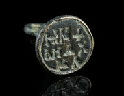 A BYZANTINE BRONZE STAMP SEAL WITH INSCRIPTION
Circa 10th-12th century AD.
Conical-shaped seal matrix with suspension loop. The inscription reads + MH...