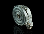 A ROMAN BRONZE CIRCULAR SEAL BOX
Circa 1st century AD.
Base and lid of equal form and size, joined by a hinge. The lid with concentric rings and a cen...