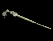 A ROMAN BRONZE HAIRPIN WITH A KEY
Circa 1st-3rd century AD.
Hairpin with the head in the form of a key; pointed end broken.
L 76 mm Ex European privat...