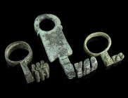 A GROUP OF THREE ROMAN BRONZE KEYS
Circa 1st-3rd century AD.
Two key rings with short projecting shanks and offset key bits, and a key with flattened ...