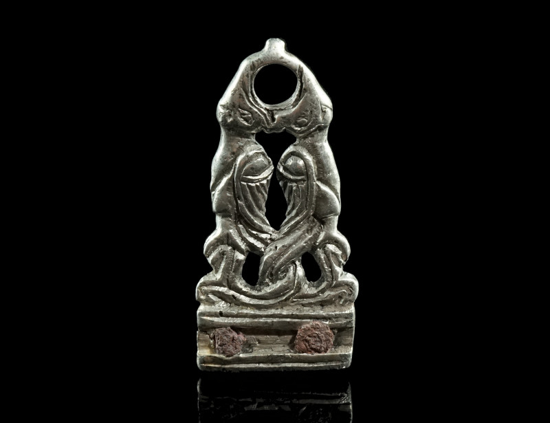 A MEDIEVAL SILVER STRAP-END WITH MYTHICAL CREATURES
Circa 9th-11th century AD.
O...