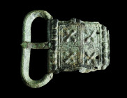 A LATE ROMAN BRONZE BELT BUCKLE
Circa 4th-5th century AD.
Buckle with rectangular plate decorated in repoussé. Two rivet holes. Probably from a milita...