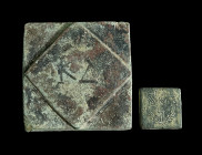 TWO INSCRIBED ANCIENT BRONZE WEIGHTS
Circa 5th-7th century AD (for the solidus weight).
A Byzantine square solidus weight inscribed SOL over I flanked...