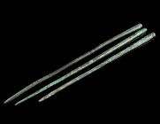 A GROUP OF THREE ROMAN BRONZE HAIRPINS
Circa 1st-4th century AD.
All with plain head; one pin resharpened.
L 10.4-12.2 cm Ex European private collecti...