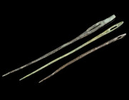 A GROUP OF THREE ROMAN BRONZE SEWING NEEDLES
Circa 1st-4th century AD.
All with flat head, two with pointed terminal.
L 9.6-12.3 cm Ex European privat...
