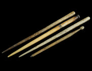 A GROUP OF FOUR ROMAN BONE HAIRPINS
Circa 1st-4th century AD.
Three pins with terminal knob or a plain head; a further pin with broken head and repair...