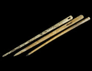 A GROUP OF TWO ROMAN BONE SEWING NEEDLES AND A HAIRPIN
Circa 1st-4th century AD.
Two needles with flat head, and a pin with plain head.
L 10.3-11 cm E...