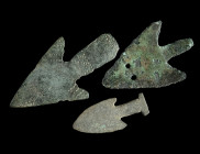 A GROUP OF THREE BRONZE ARROWHEADS
Circa 2nd-1st millennium BC.
A group of (votive?) arrowheads made of thin bronze sheet; of different shape/design. ...