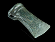A EUROPEAN LATE BRONZE AGE SOCKETED AXE HEAD
Circa 1000-800 BC.
Socketed and looped bronze axe head with banded collar and ribbed decoration.
L 72 mm ...