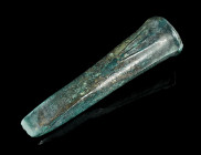 A EUROPEAN LATE BRONZE AGE SOCKETED CHISEL
Circa 1000-800 BC.
Socketed bronze chisel with ribbed decoration.
L 96 mm From the inventory of an Austrian...