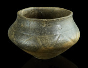 AN URNFIELD CULTURE CERAMIC BOWL
Circa 1300-800 BC.
Decorated bowl with flat base. A few cracks and minor restoration to the rim.
H 7.5 cm, Diameter 1...