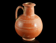 A DECORATED ROMAN RED SLIP WARE JUG
Circa 3rd century AD.
African Red Slip Ware (ARS) jug with globular body, cylindrical neck with flaring mouth, and...