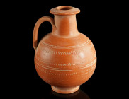A DECORATED ROMAN RED SLIP WARE JUG
Circa 3rd century AD.
African Red Slip Ware (ARS) jug with globular body, cylindrical neck with flaring mouth, and...