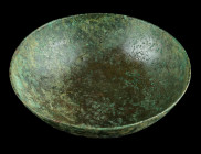 A GREEK BRONZE BOWL
Circa 4th-3rd century BC.
Plain bronze bowl. Surface deposits. Surface treated with a layer of protective acrylic resin (Paraloid)...