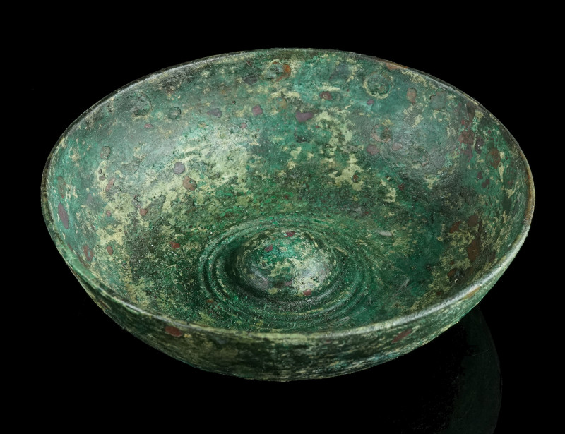 A GREEK BRONZE PHIALE WITH AN OMPHALOS
Circa 5th-4th century BC.
Cast bronze phi...