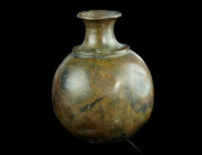 AN ANTIQUE GLOBULAR BRASS OR BRONZE FLASK
17th-19th century AD (?).
Some damage and a few cracks.
H 71 mm Ex European private collection, acquired on ...