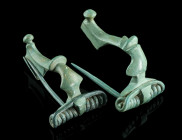TWO ROMAN BRONZE BROOCHES
Circa 2nd-3rd century AD.
Two strongly profiled brooches. Both with spring and pin. Catch plate of one brooch partly broken....