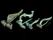 A GROUP OF FOUR ROMAN BRONZE BROOCHES
Circa 1st-2nd century AD.
Two strongly profiled brooches, and two bow brooches. All with spring and pin.
L 29-51...