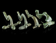 A GROUP OF FOUR ROMAN BRONZE BROOCHES
Circa 2nd-4th century AD.
A strongly profiled brooch with spring and partly preserved pin, a bow brooch with spr...