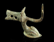 A ROMAN BRONZE FOOT IN THE SHAPE OF A DOLPHIN
Circa 2nd-3rd century AD.
Foot in the shape of a stylised dolphin with a thorn/hook and remains of an op...