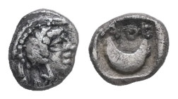 Attica, Athens. AR Tetartemorion, 0.16 g 5.13 mm. Circa 400-353 BC.
Obv: Helmeted head of Athena right
Rev: AΘΕ above crescent within incuse square.
R...