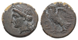 Caria, Halikarnassos. Ae, 1.05 g 12.45 mm. 3rd century BC.
Obv: Head of Apollo left.
Rev.: [ΑΛΙ]; Eagle standing to left, wings open; to left, kithara...