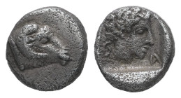 Caria, Kasolaba. AR Hemiobol. 0.54 g. - 7.62 mm. 4th century BC.
Obv.: Young male head right; Carian letters below chin and behind.
Rev.: Head of ram ...