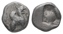 Ionia, Teos. AR Eighth Stater or Trihemiobol, 1.38 g. - 10.48 mm. Circa 540-510 BC.
Obv.: Griffin with curled wings seated right.
Rev.: Incuse squar...