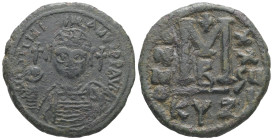 Justinian I, AD 527-565. AE, Follis. 14.94 g. 33.33 mm. Cyzicus. 
Obv: DNIVSTINI-ANVS PPAVC. Frontal bust of Justinian I wearing helmet with plume, di...