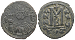 Justinian I, AD 527-565. AE, Follis. 17.65 g. 35.19 mm. Cyzicus. 
Obv: DNIVSTINI-ANVS PPAVC. Frontal bust of Justinian I wearing helmet with plume, di...
