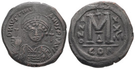 Justinian I, AD 527-565. AE, Follis. 17.10 g. 33.08 mm. Constantinople.
Obv: DNIVSTINI-ANVS PPAVC. Frontal bust of Justinian I wearing helmet with plu...