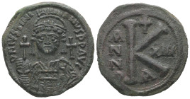 Justinian I, AD 527-565. AE, Half Follis. 12.11 g. 29.67 mm. Constantinople. 
Obv: DN IVSTINI - ANVS PP AVG. Helmeted, cuirassed bust facing, holding ...