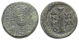 Justinian I, AD 527-565. AE, Decanummium. 4.23 g. 16.51 mm. Ravenna. 
Obv: DN IVSTINIANVS PP AVG. Helmeted, cuirassed bust facing, holding cross on gl...