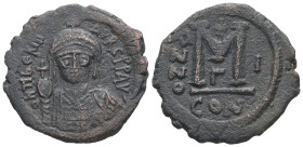 Maurice Tiberius, AD 582-602. AE, Follis. 11.06 g. 29.98 mm. Constantinople.
Obv: DN TIBER MAVRC PP AV. Crowned, draped and cuirassed bust facing, hol...