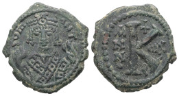 Maurice Tiberius, AD 582-602. AE, Half Follis. 6.25 g. 23.06 mm. Theoupolis (Antioch).
Obv: Crowned bust facing, wearing consular robes, holding mappa...