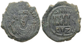 Phocas, AD 602-610. AE, Follis. 11.42 g. 30.56 mm. Cyzicus.
Obv: D N FOCAS PЄRP AVG. Crowned bust facing, wearing consular robes and holding mappa and...
