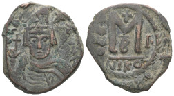 Heraclius, AD 610-641. AE, Follis. 12.42 g. 29.14 mm. Nicomedia.
Obv: Plumed-helmeted and cuirassed bust facing, bearded, holding cross on globe and s...